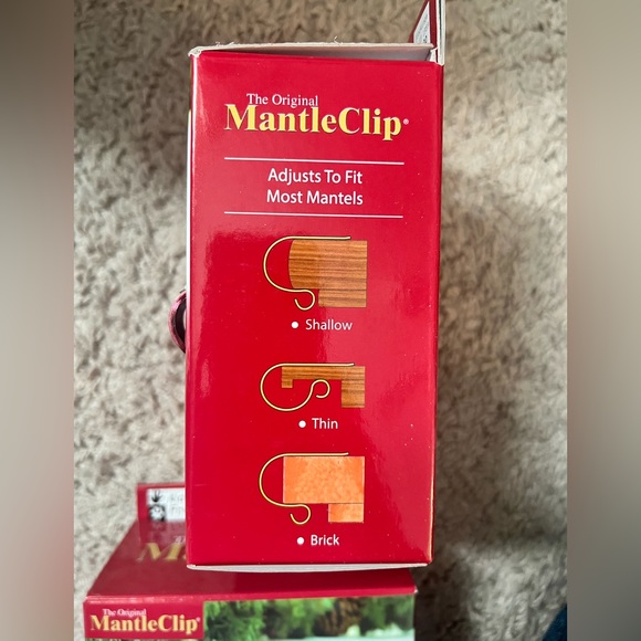 The Original Mantle Clip. 8 available. Red color. Adjusts to fit most mantles. - Picture 2 of 3
